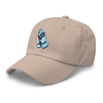 Beige cap with a blue and white goalie praying hands graphic on a white background