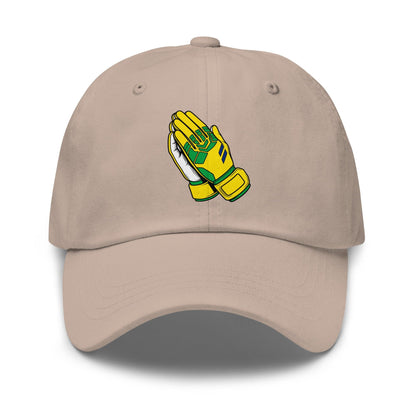 Beige cap with a graphic of yellow goalie gloves praying on a white background