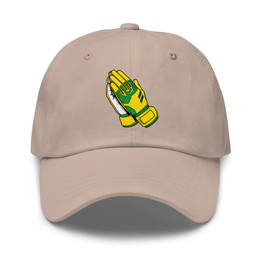 Beige cap with a graphic of yellow goalie gloves praying on a white background
