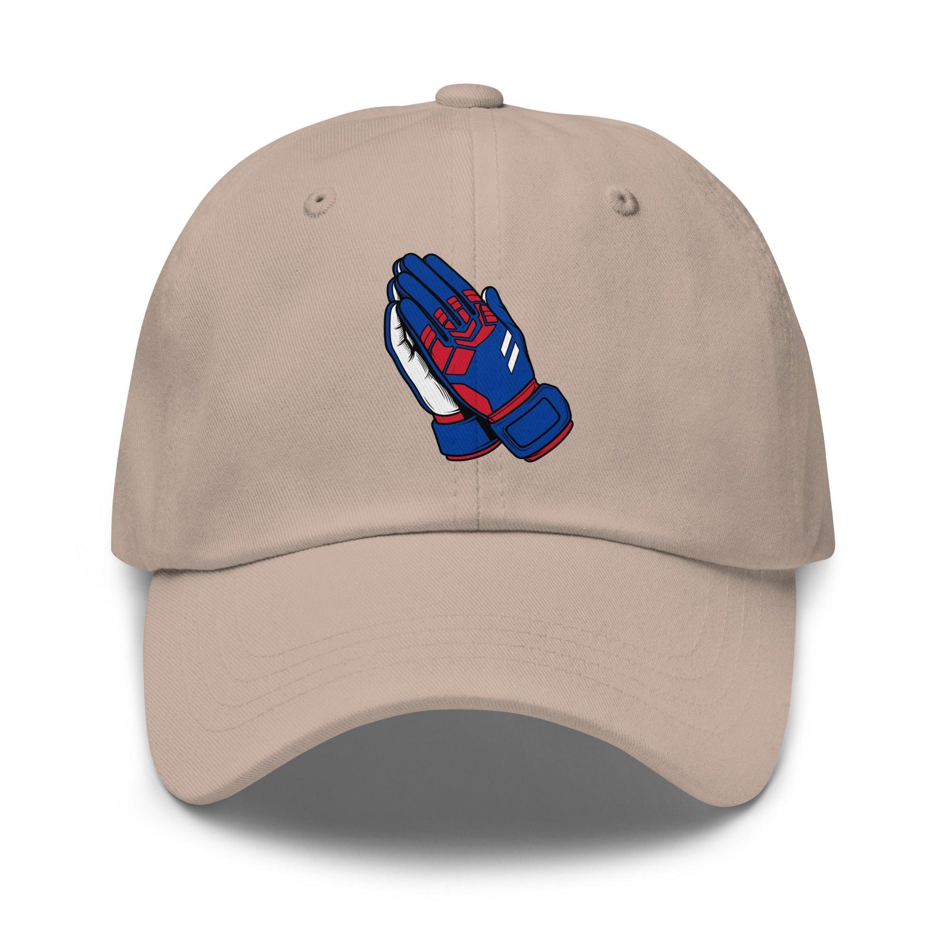Beige soccer cap with blue and red praying goalie hands design on a white background