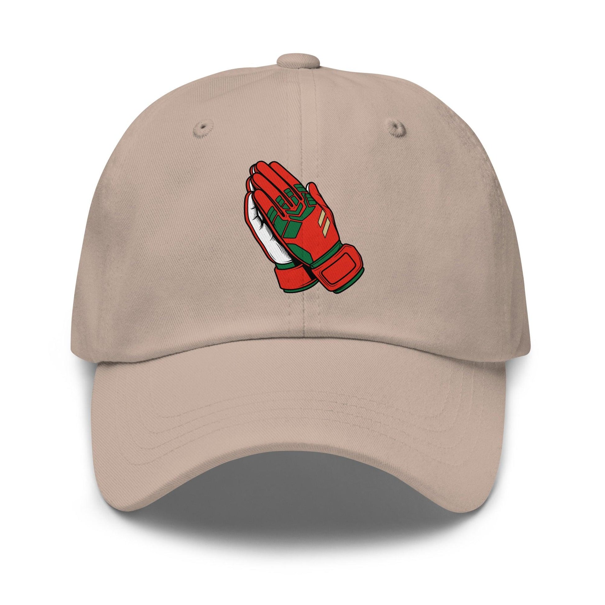 Beige soccer hat with red and green praying goalie gloves design on a white background