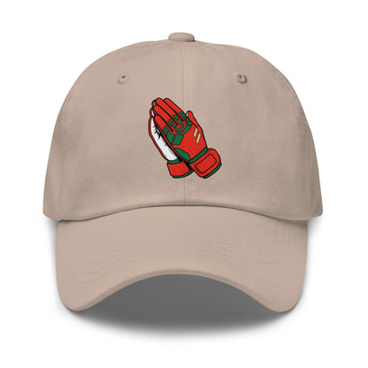 Beige soccer hat with red and green praying goalie gloves design on a white background