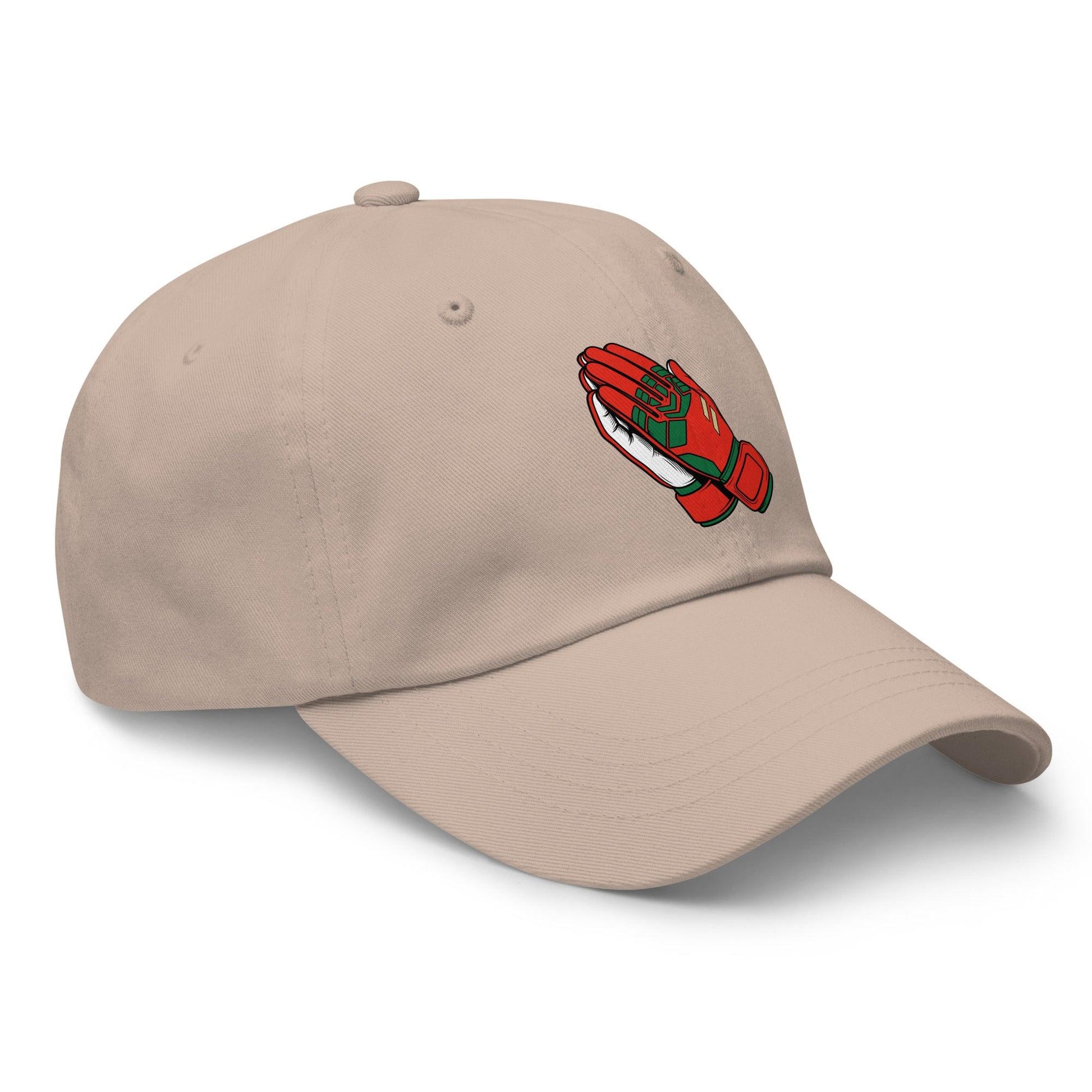 Beige soccer hat with a red and green goalie gloves logo on a white background