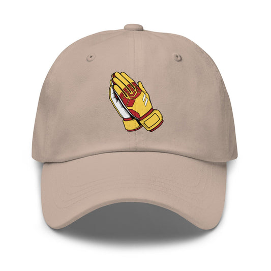 Beige Spain soccer cap with red and blue goalie praying hands design on a white background