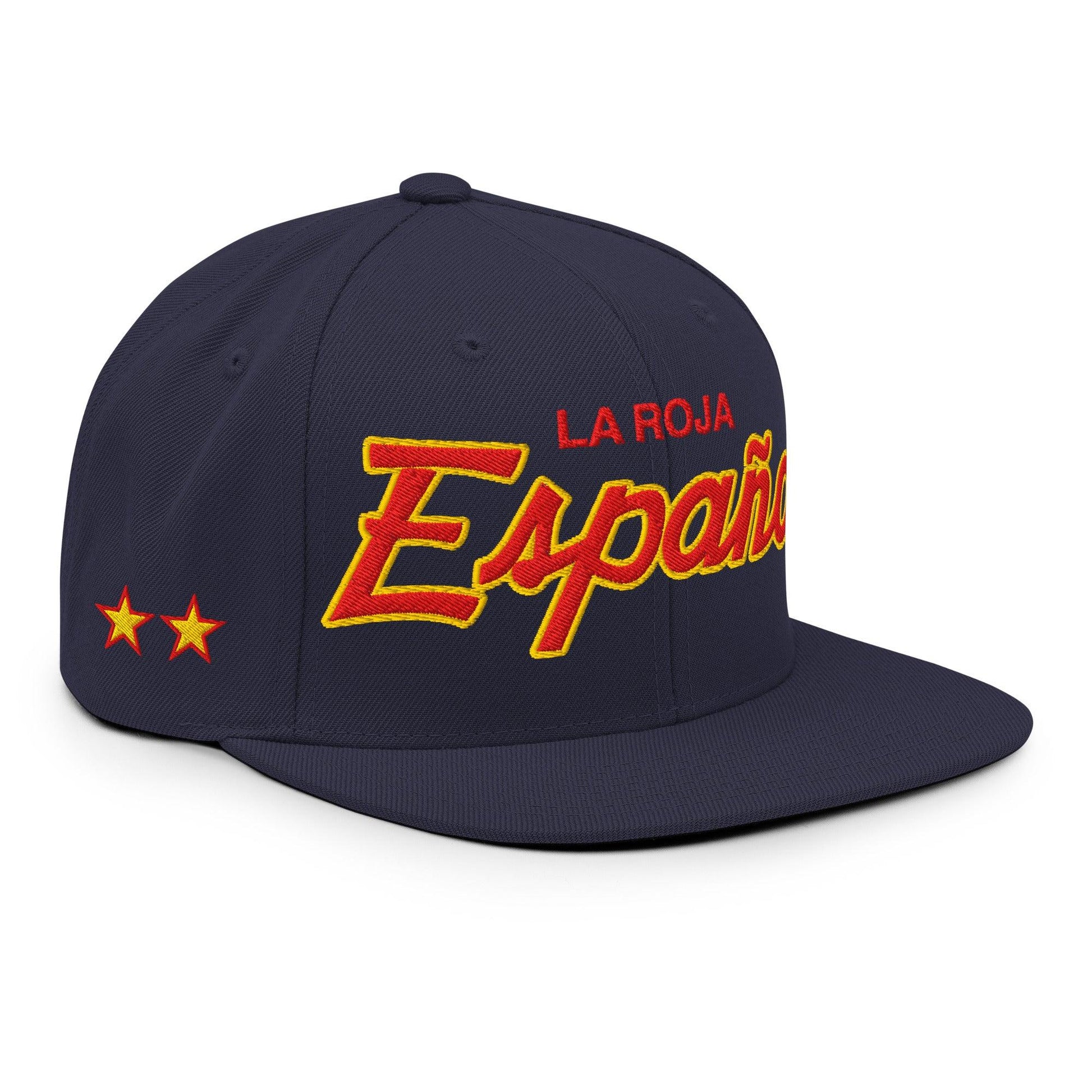 A navy blue flat-brim baseball cap with 'LA ROJA Espana' embroidered on the front in red and yellow, featuring two yellow stars on the side, set against a plain white background.