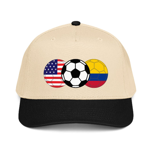 Beige snapback hat with soccer ball and American and Colombian flags on a white background