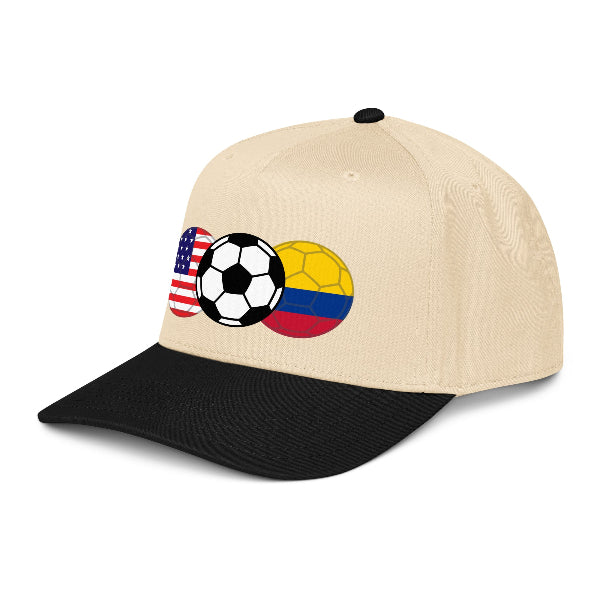 Beige and black snapback hat with soccer ball and flag design of USA and Colombia on a white background
