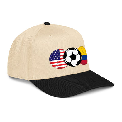 Beige snapback hat featuring an American flag, soccer ball, and Colombian flag design on a white background.