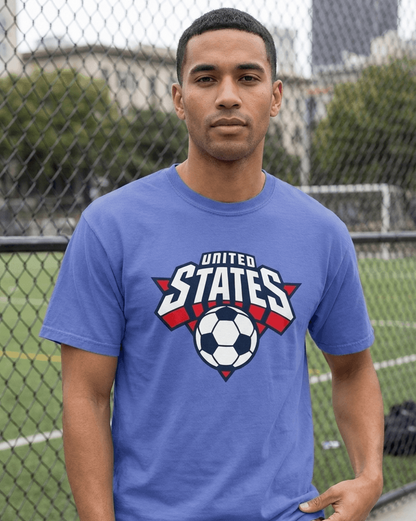 Man wearing a blue t-shirt with a soccer design and 'United States' text, standing outdoors.