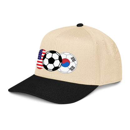 Beige and black cap with soccer ball and USA and South Korea flags design on a white background