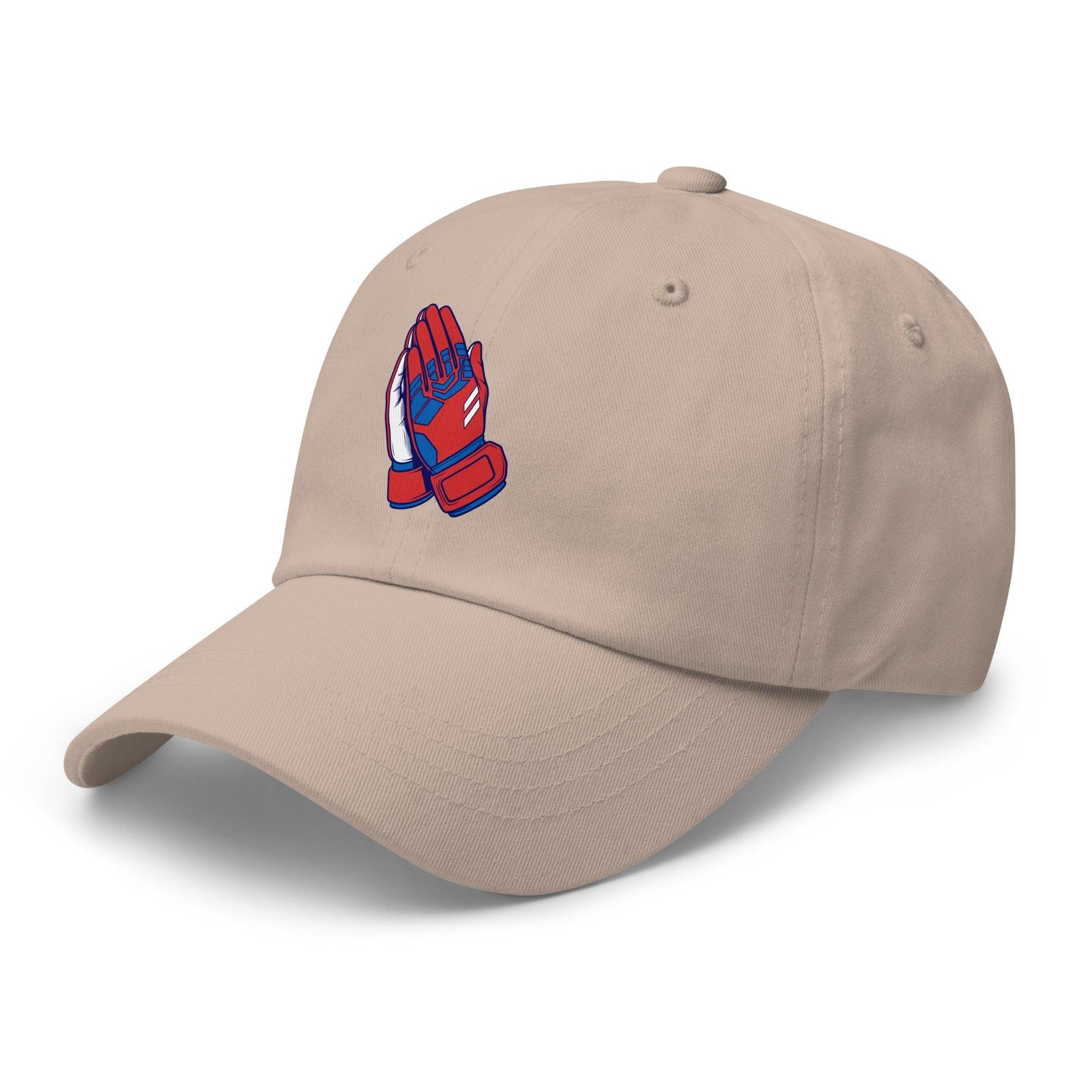 Beige cap with a red and blue goalie prayer hands logo on a white background